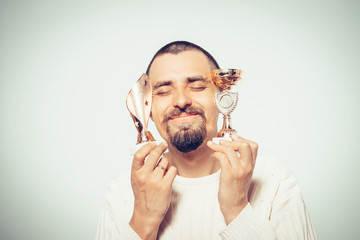 man with a golden cup