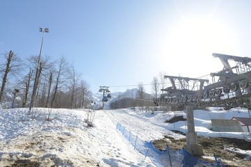 vacationers on the background of peaks in a ski resort