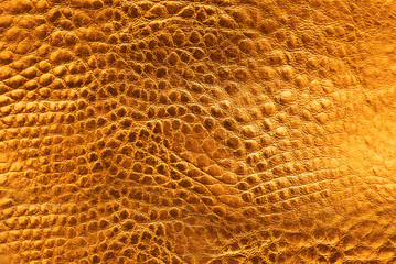 Texture of orange leather as background, closeup