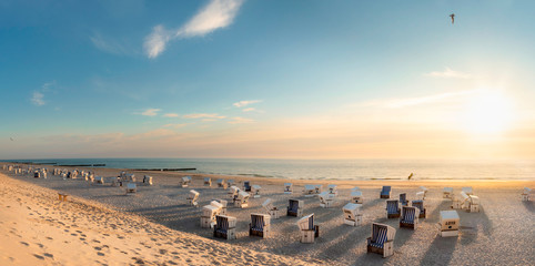 Beach scenery at sunset at North Sea. Beach chairs at Red Cliff, Sylt island.