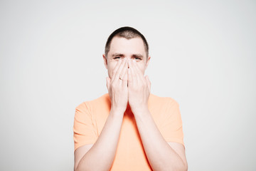 man laughs and covers her mouth