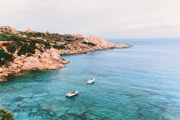 Fototapeta na wymiar Boats in Mediterranian Sea at Capo Testa