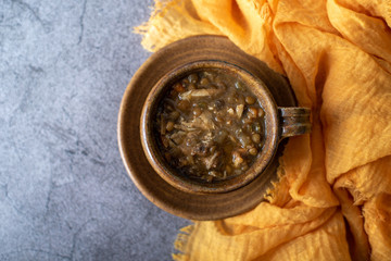 A bowl of lentil soup with chicken, Mediterranean soup with thick stew like broth. 