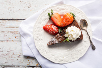 A slice of sticky chocolate mud cake, brownie or traditional Swedish kladdkaka