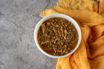 A bowl of lentil soup with chicken, Mediterranean soup with thick stew like broth. 