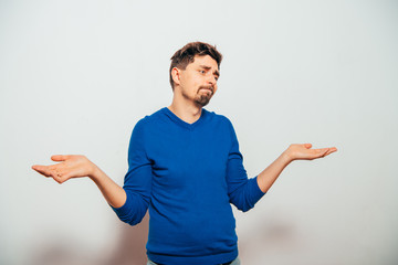 man throws up his hands