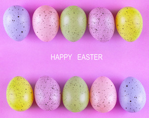 Easter colorful eggs on a pink background, Beautiful bright background, minimalism