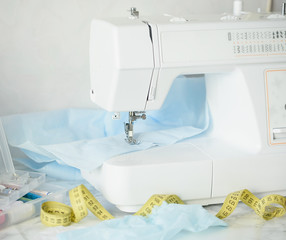 Macro view of Detail on sewing machine. Selective Focus. Homemade medical mask in process. DIY of virus face mask