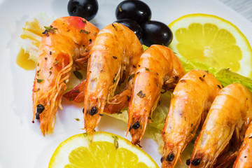 Fried langostins in a white plate