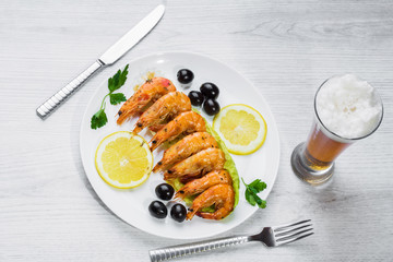 Fried langostins in a white plate