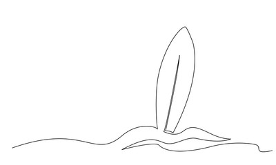 Long surfboard standing up in sand of beach