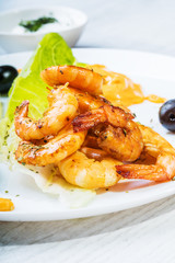 Fried langostins in a white plate