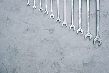 Spanners. Repair tool wrench set. Set of wrenches of different sizes and diameters on a gray...