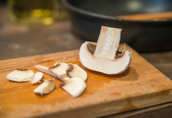 champion mushrooms chopped on a cutting board