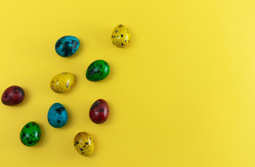 Hand-painted eggs on a yellow background, blank for postcard