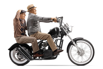 Obraz na płótnie Canvas Elderly men riding on a custom chopper