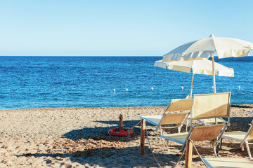 Umbrella and longue chair at Chia beach Mediterranean sea