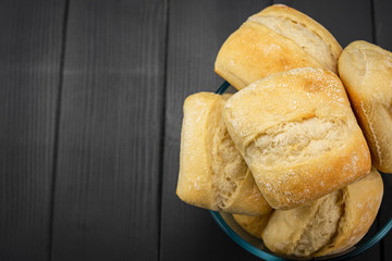Fresh bread stacked in a column, golden and crisp, freshly made