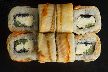 Japanese food: Set of salmon sushi and rolls with salmon and eel