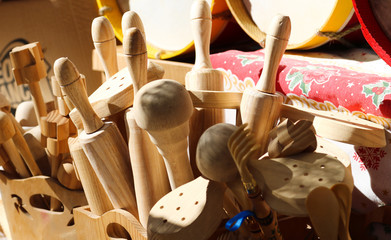 Kitchen utensils made of wood, various objects used in traditional cuisine.