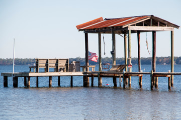 boat dock pier in perdido bay lillian alabama clear blue sky