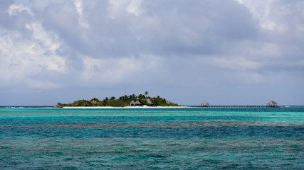 Blue coral sea and island panorama, Maldives