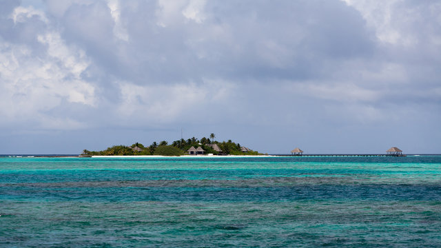 Blue coral sea and island panorama, Maldives
