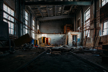 Fototapeta na wymiar Inside old burnt abandoned ruined industrial building