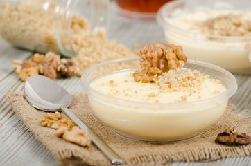 Turkish desert keskul rice pudding with hazelnut powder stock photo