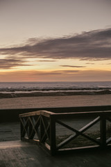Fototapeta na wymiar sunset at sea wooden fence