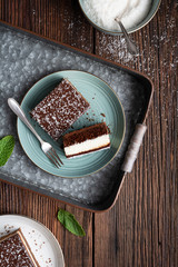 Delicious homemade dessert, fudgy coconut brownies topped with chocolate ganache glaze