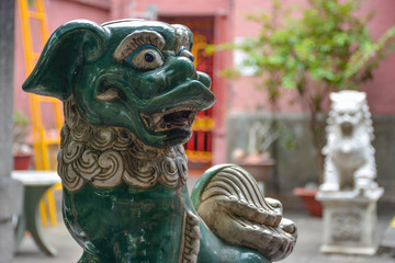 Chinese guardian lion in the Assembly Hall of Fujian Chinese. Hoi An, Vietnam