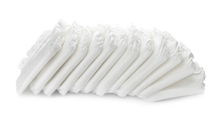 Pile of baby diapers isolated on white