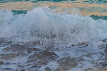 sea water with a wave tending to the shore