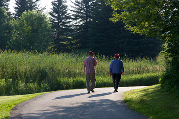 Senior couple walking in the public park