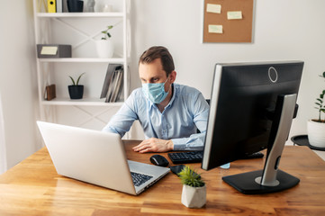 Man in a medical mask at the office