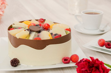 Birthday cake decorated with colorful sauce