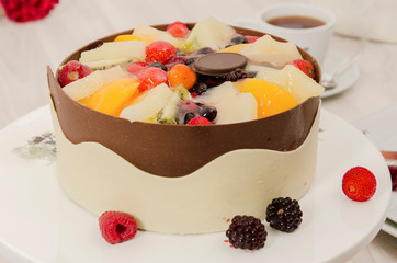 Birthday cake decorated with colorful sauce