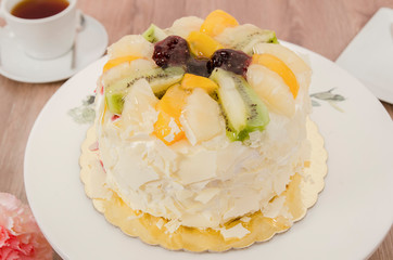 Birthday cake decorated with colorful sauce