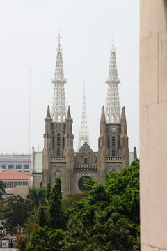 Jakarta Katredal Church is a place of worship for Christians, opposite the Istiqlal Mosque - view from Istiqlal Mosque