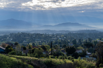 Morning sunbeams and strom clouds above the San Fernando Valley area of Los Angeles in Southern California.  