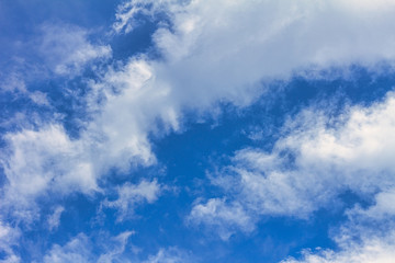 Blue sky with clouds at a sunny day.