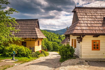 Fototapeta na wymiar A street with ancient houses in the village of Vlkolinec, Slovakia, Europe.