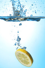 Lemon is falling into the water