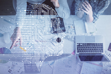 Double exposure of man and woman working together and human brain hologram drawing. Brainstorm...