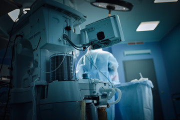 In the hospital operating room. An international team of professional surgeons and assistants works...