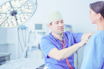 Man surgeon at work in operating room