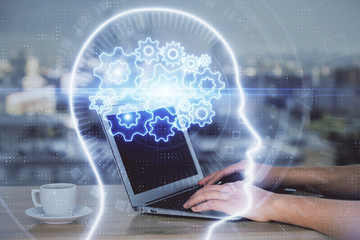 Multi exposure of woman hands working on computer and human brain hologram drawing. Ai tech concept.