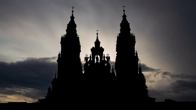 Santiago de Compostela: Time Lapse at Sunrise with Fast Clouds and Dark Silhouette of Cathedral, Spain