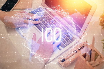 Double exposure of woman hands typing on computer and crypto market theme hologram drawing....